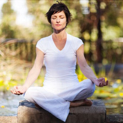 Photo of a woman sitting in meditation