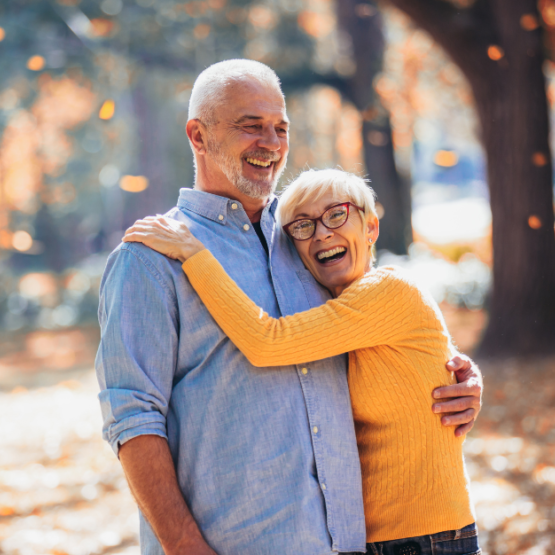 Photo of an older couple posing outdoors