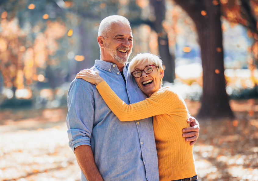 Photo of an older couple posing outdoors